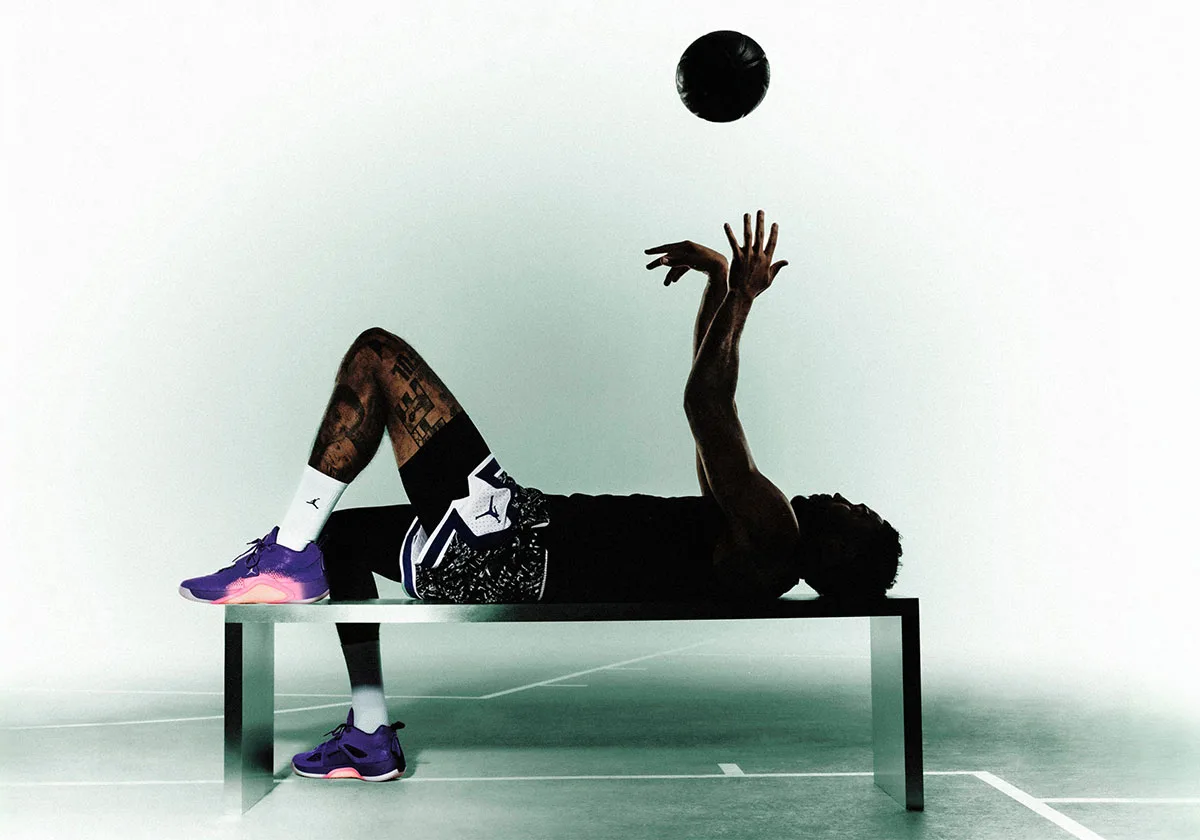 On-foot lifestyle, man lying on bench wearing purple-pink pair, Jordan Tatum 5