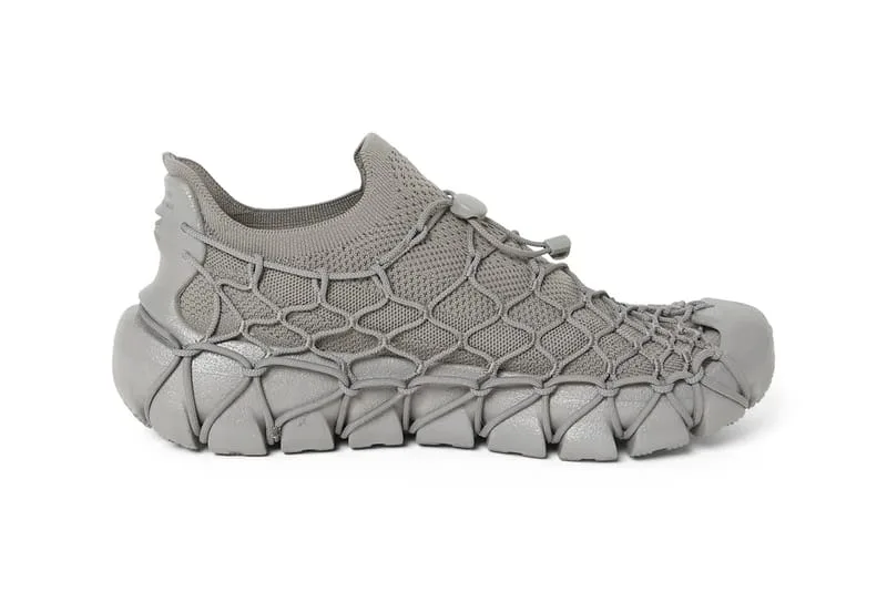 lateral view, grey webbed cage overlay on knit upper, heel logo tab visible, x N.HOOLYWOOD COMPILE
