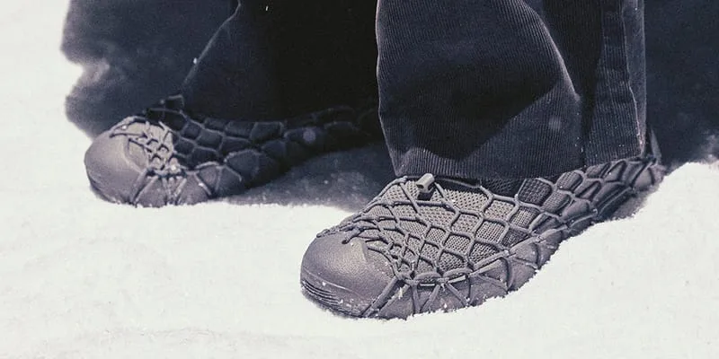 on-foot, black caged shoes in snow with toggle lace detail visible, x N.HOOLYWOOD COMPILE
