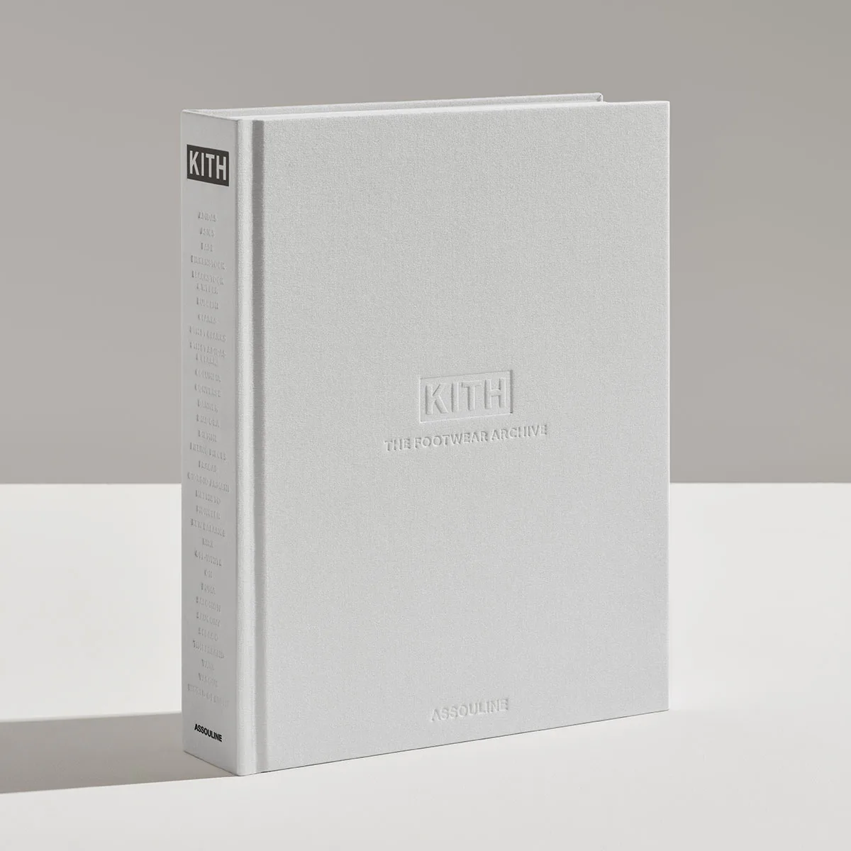 angled grey hardcover book showing embossed logo and spine text, The Footwear Archive