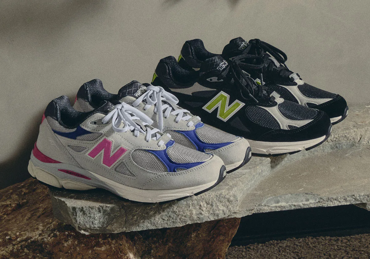 Pair of lateral views, grey/pink/blue and black/lime colourways on stone slab, Kith x United Arrows & Sons New Balance 990v3