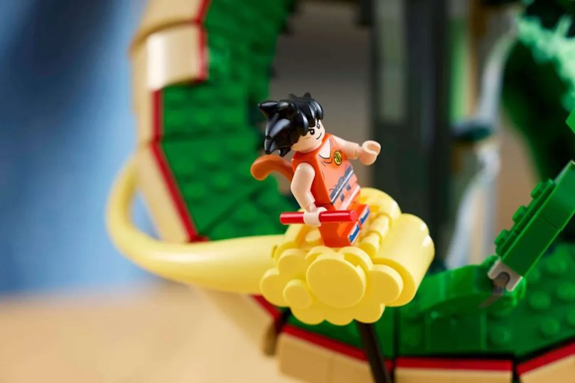 close-up of orange Goku minifigure riding yellow flying nimbus cloud, Shenron & Goku