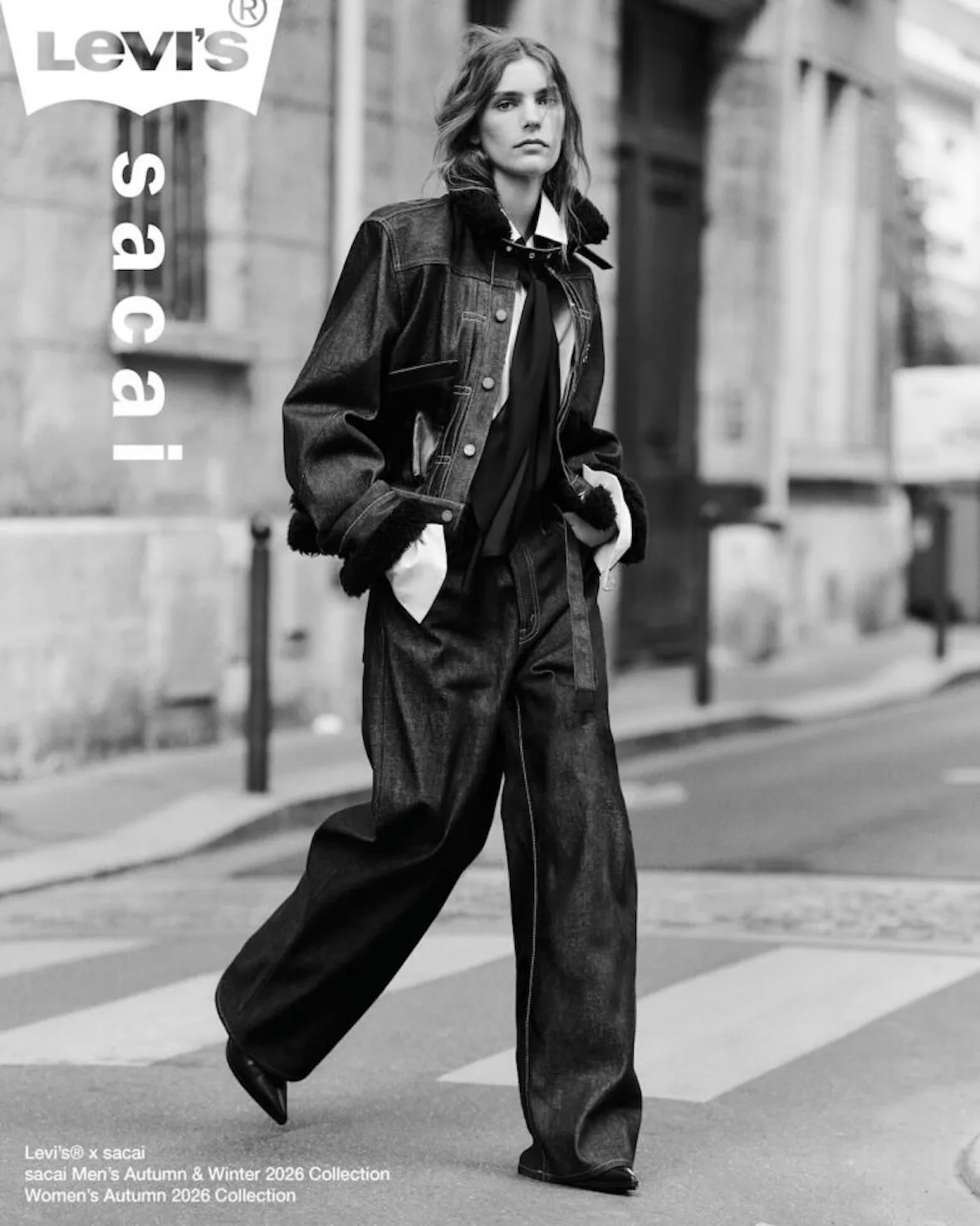 monochrome street shot, black shearling collar jacket, wide trousers, logo text, Sacai FW26 Collection