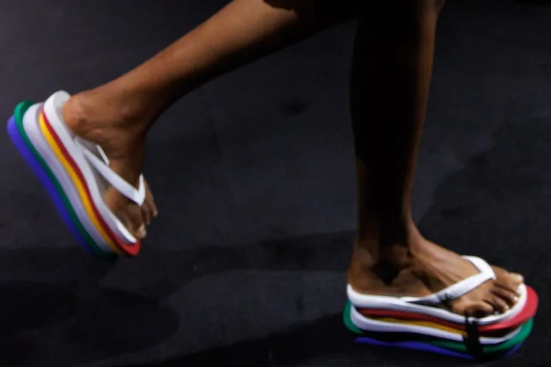 close-up on-foot rainbow layered platform soles mid-stride, Havaianas Slim 6Toe