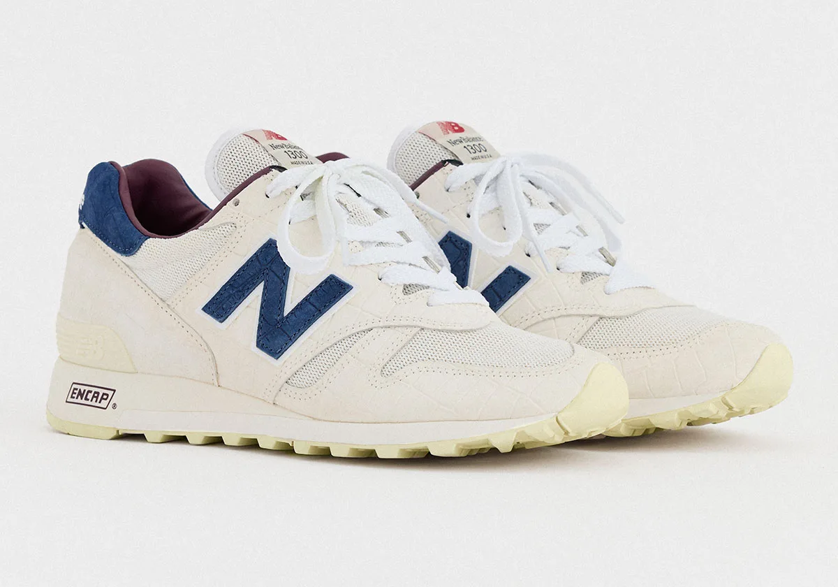 pair, lateral view, off-white croc-textured leather with navy N logo and burgundy heel tab, New Balance 1300 “Sea Salt”