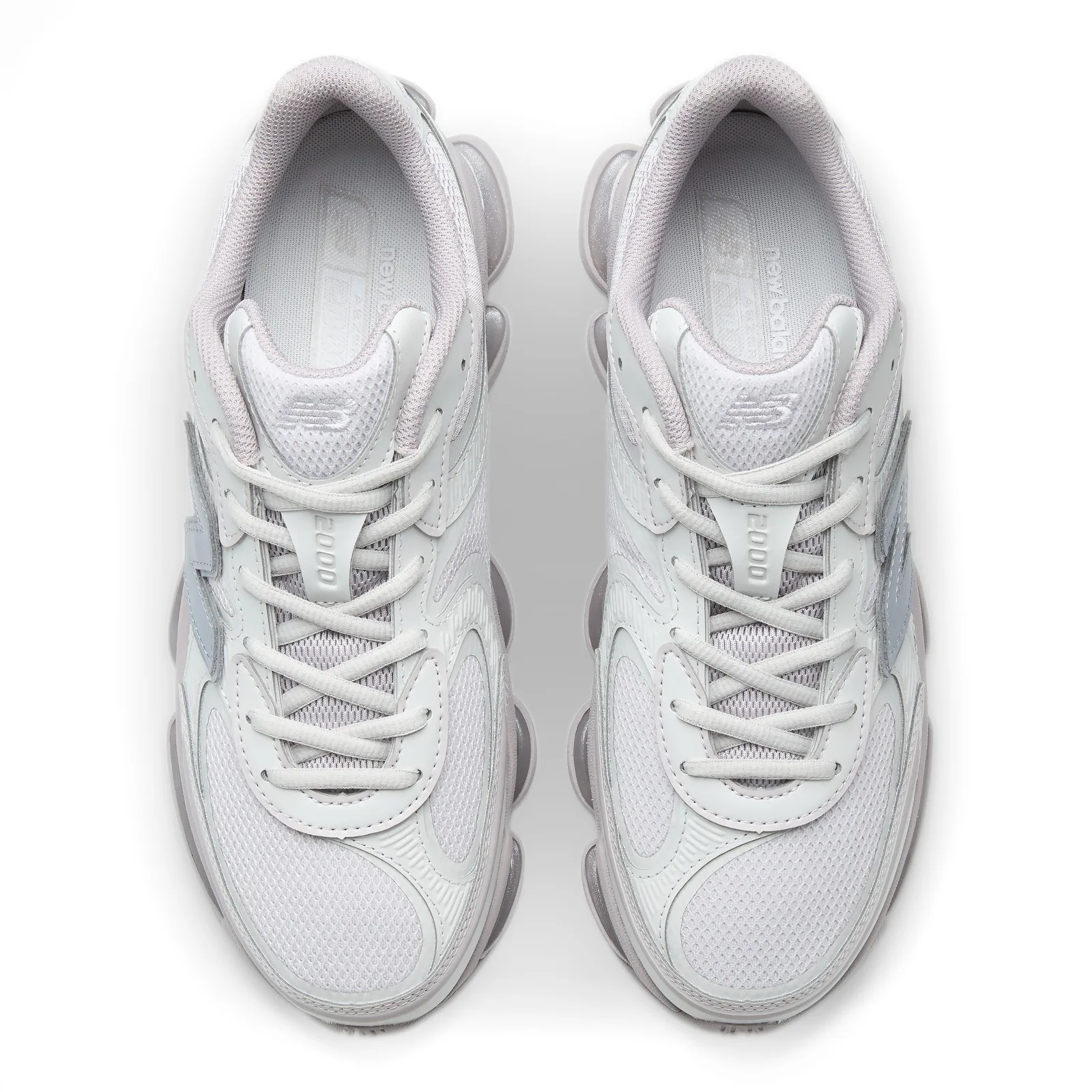 top-down view of pair, grey N logo, '2000' text on tongue pull, laces, Horizon Grey