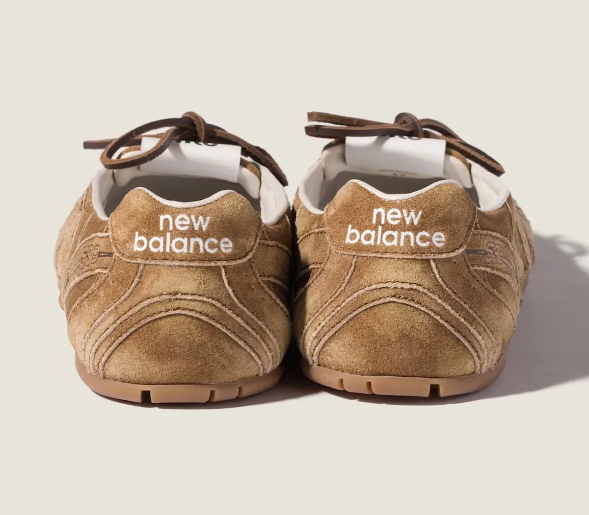 heel view pair, tan suede with new balance wordmark in white text, SL Ballerina Pack