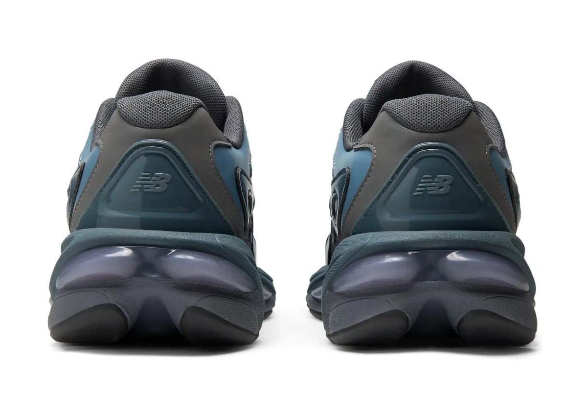 heel view of pair, dark grey counters with N logo and purple midsole pods, Shadow Blue