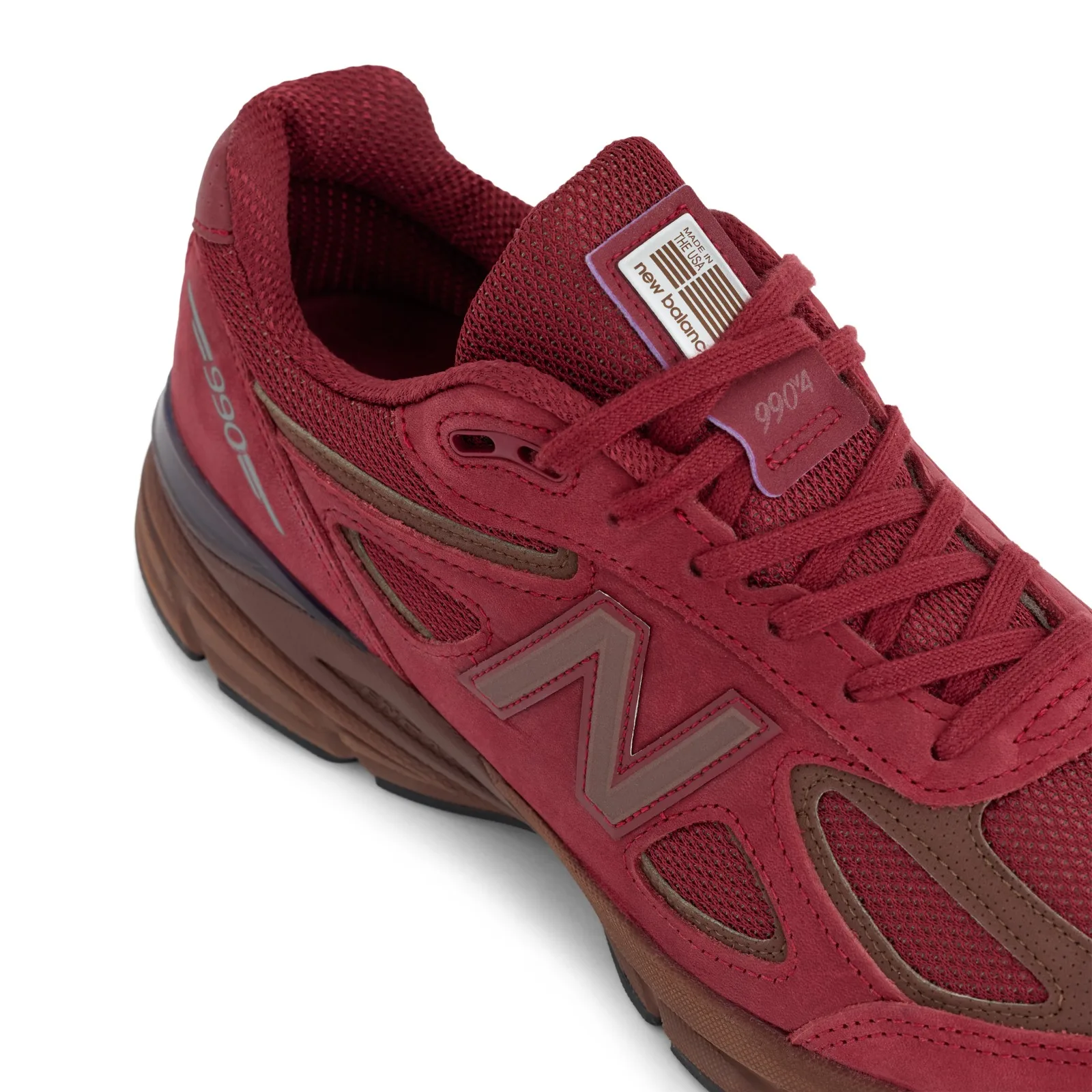 Close-up of heel and lacing area with N logo and 990v4 tongue tag, Monarch Burgundy