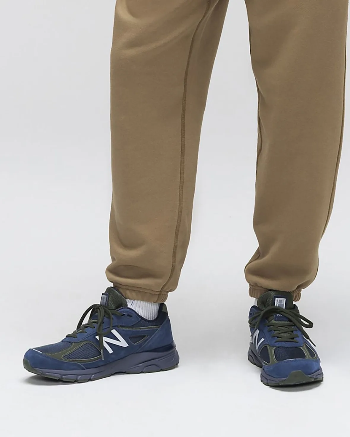 on-foot pair, lateral angle, navy suede mesh panels, olive laces and heel tab, Made in USA