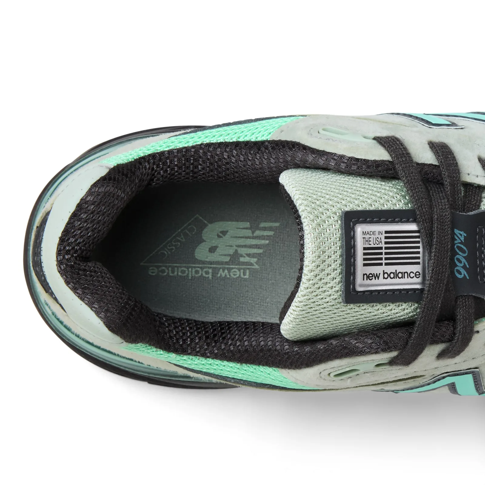 close-up of tongue and laces, 990v4 tag, teal N logo, mint mesh panels, Silver Moss/Bright Mint