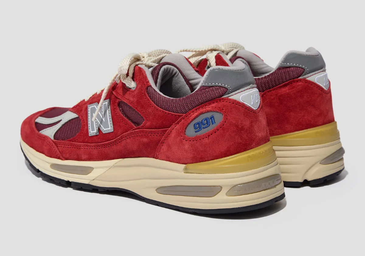 heel and lateral pair view, red suede with 991 and V2 tabs, cream midsole, Karanda Red