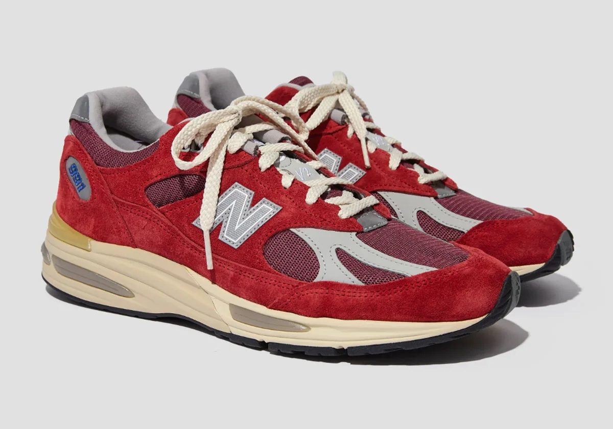 lateral pair view, red suede, grey N logo, cream laces on grey background, Karanda Red