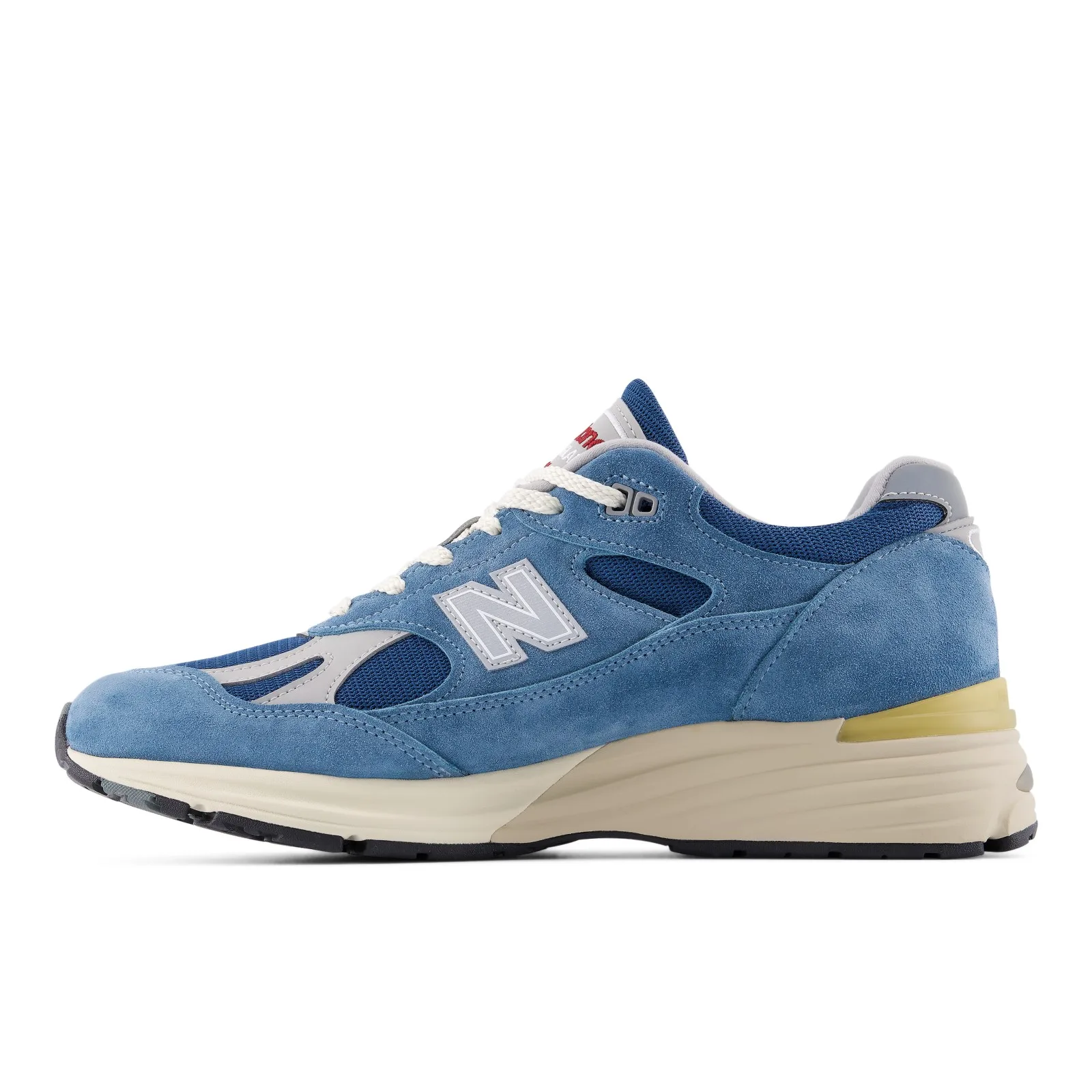 medial side view, blue suede with grey N logo and pale yellow midsole strip, Poseidon