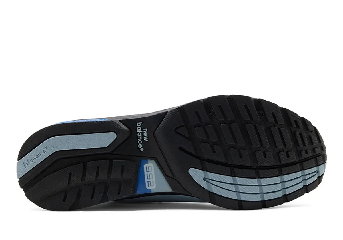 outsole view, black tread with light blue accents and 992 branding, Blue Gemstone