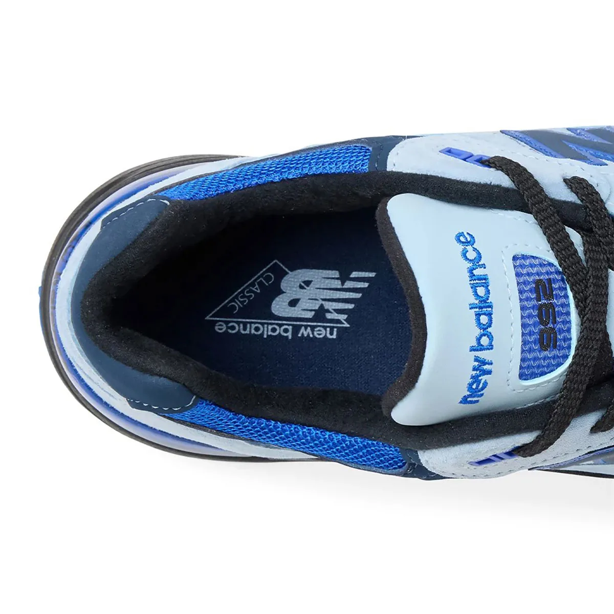 top-down close-up of tongue, new balance classic logo on navy insole, Blue Gemstone
