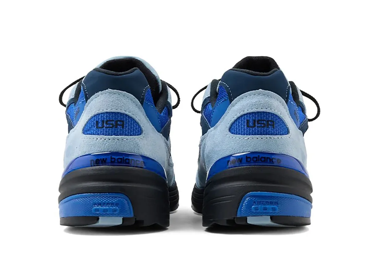 heel view of pair, light blue suede with royal blue mesh and black USA text, New Balance 992 “Blue Gemstone”