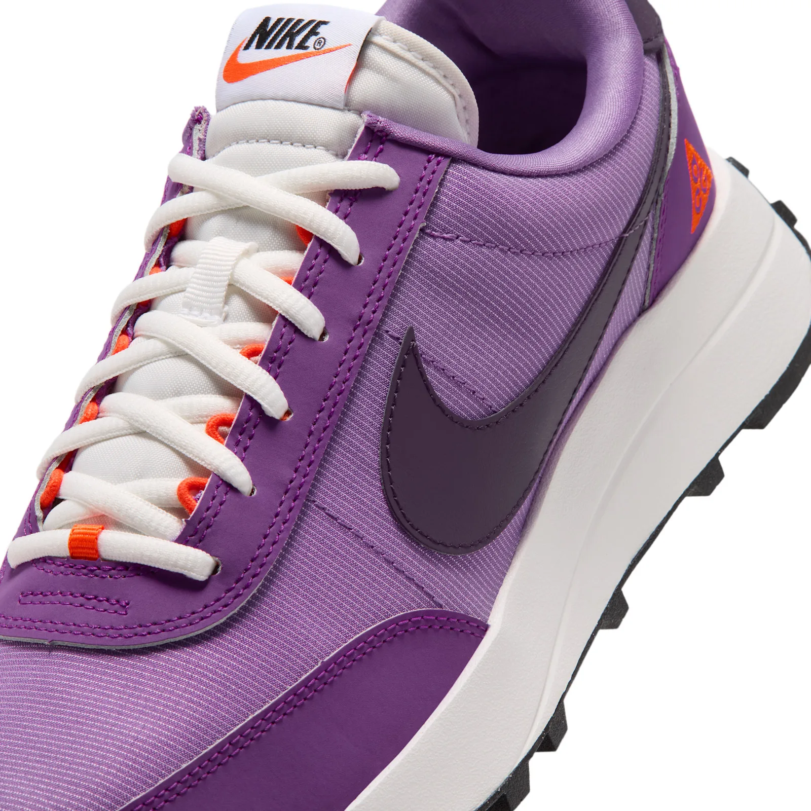Toe and eyestay detail, plum swoosh with white laces and orange lace tips, Monarch Purple