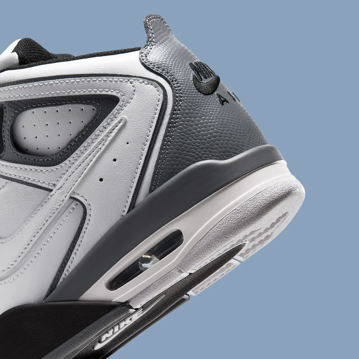 close-up heel detail, grey and white leather with black Nike Air text, Air Flight Falcon