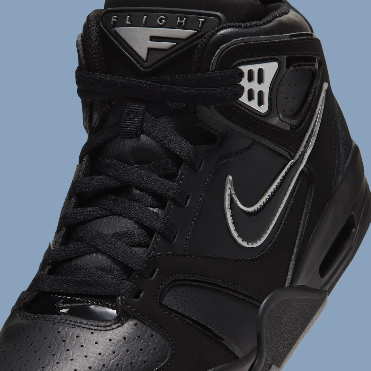 close-up tongue detail, black FLIGHT tab and silver eyelet plate, Air Flight Falcon