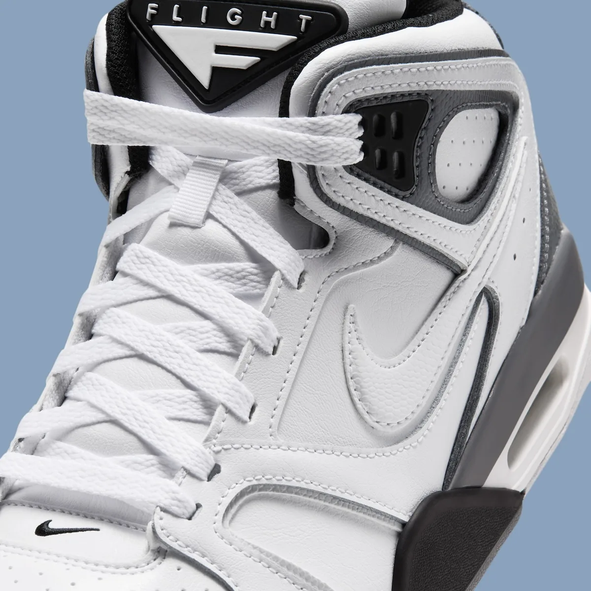 close-up tongue detail, white FLIGHT tab and black Nike swoosh on toe, Air Flight Falcon