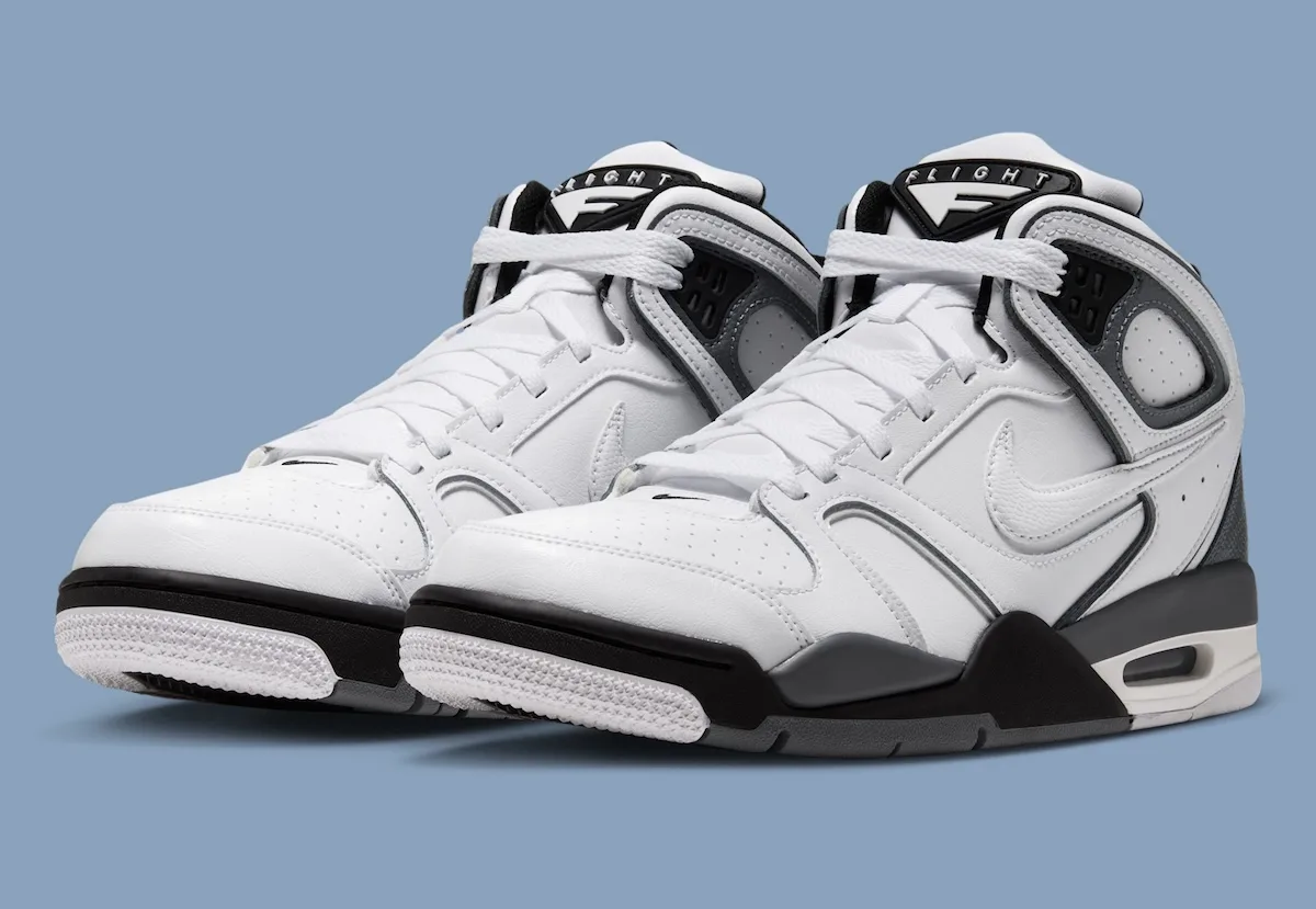 pair, three-quarter view, white upper with black toe and grey FLIGHT tab on heel, Air Flight Falcon