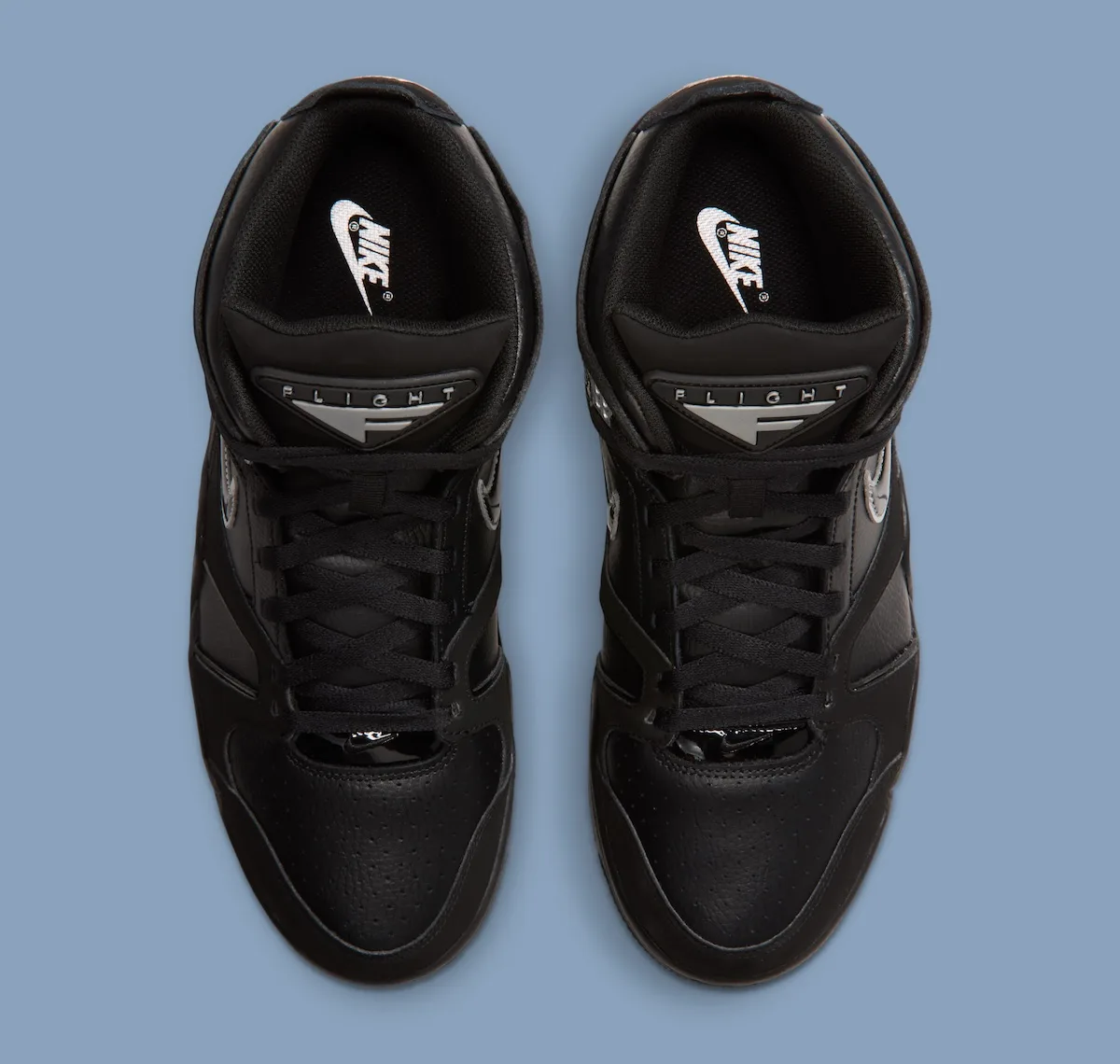 pair, top-down view, black upper with FLIGHT branding on black tongue, Air Flight Falcon