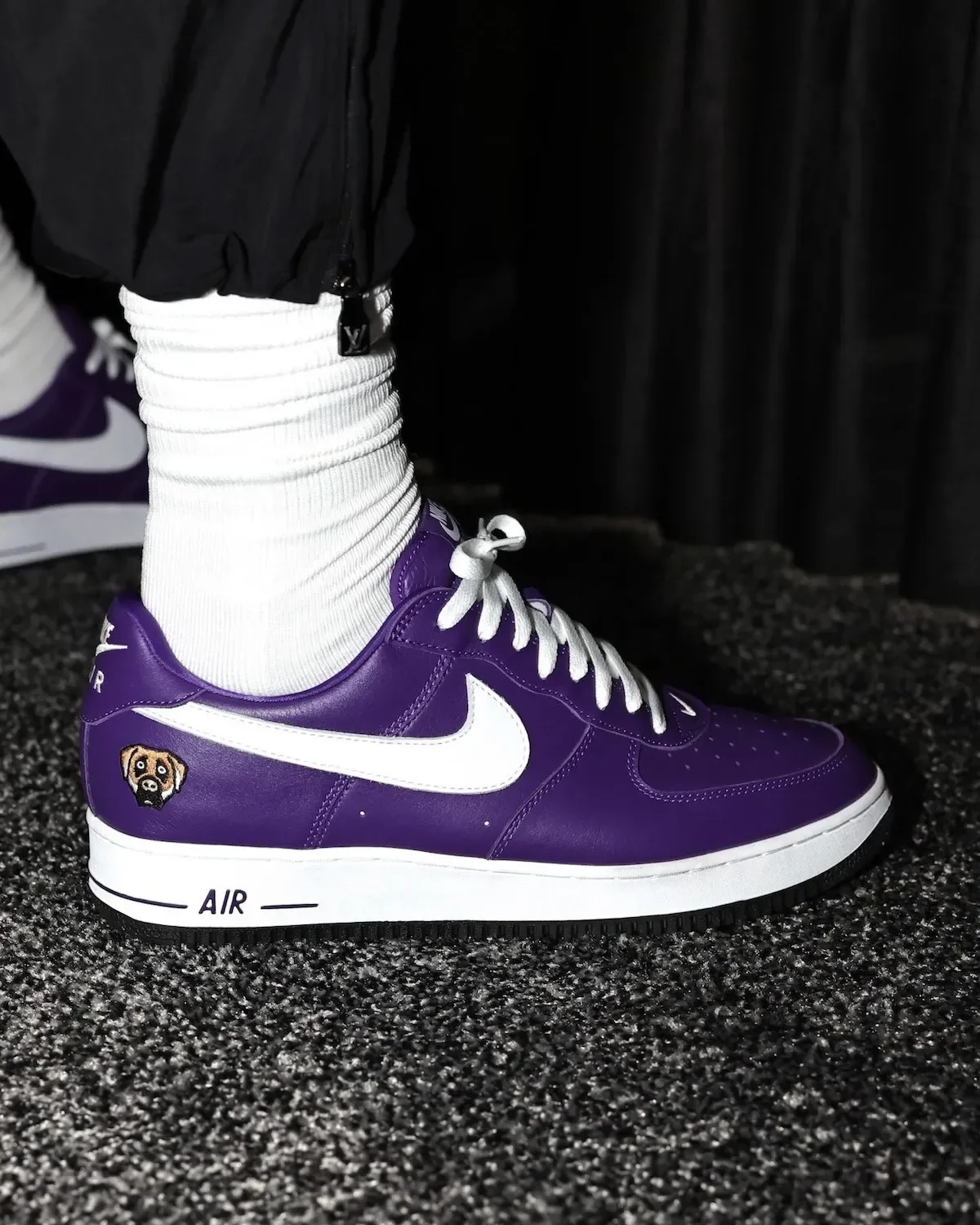 on-foot lateral view in purple leather with white swoosh and dog patch on toe, Victor Victor Collection