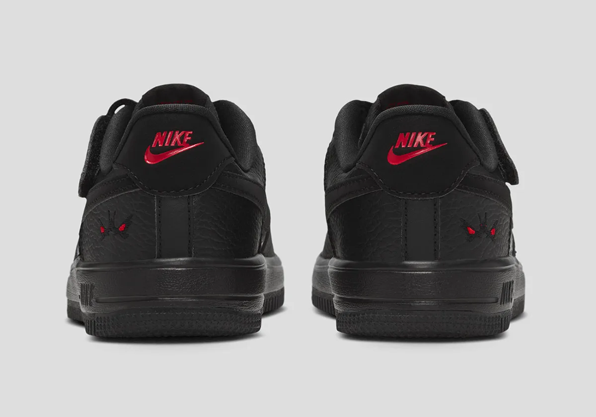 heel pair view, red embroidered Nike swoosh on each black heel tab, Beast