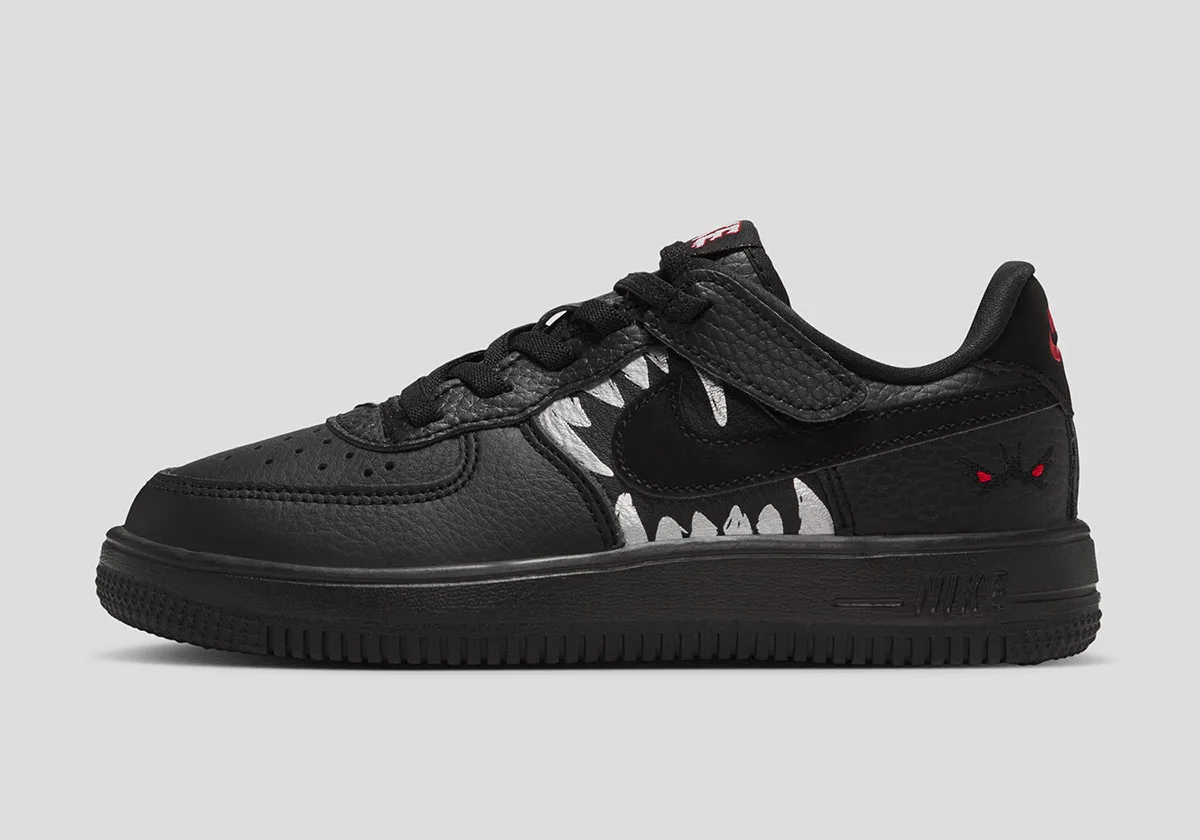 lateral view, black upper with red tongue tab and fang-like graphic, Beast