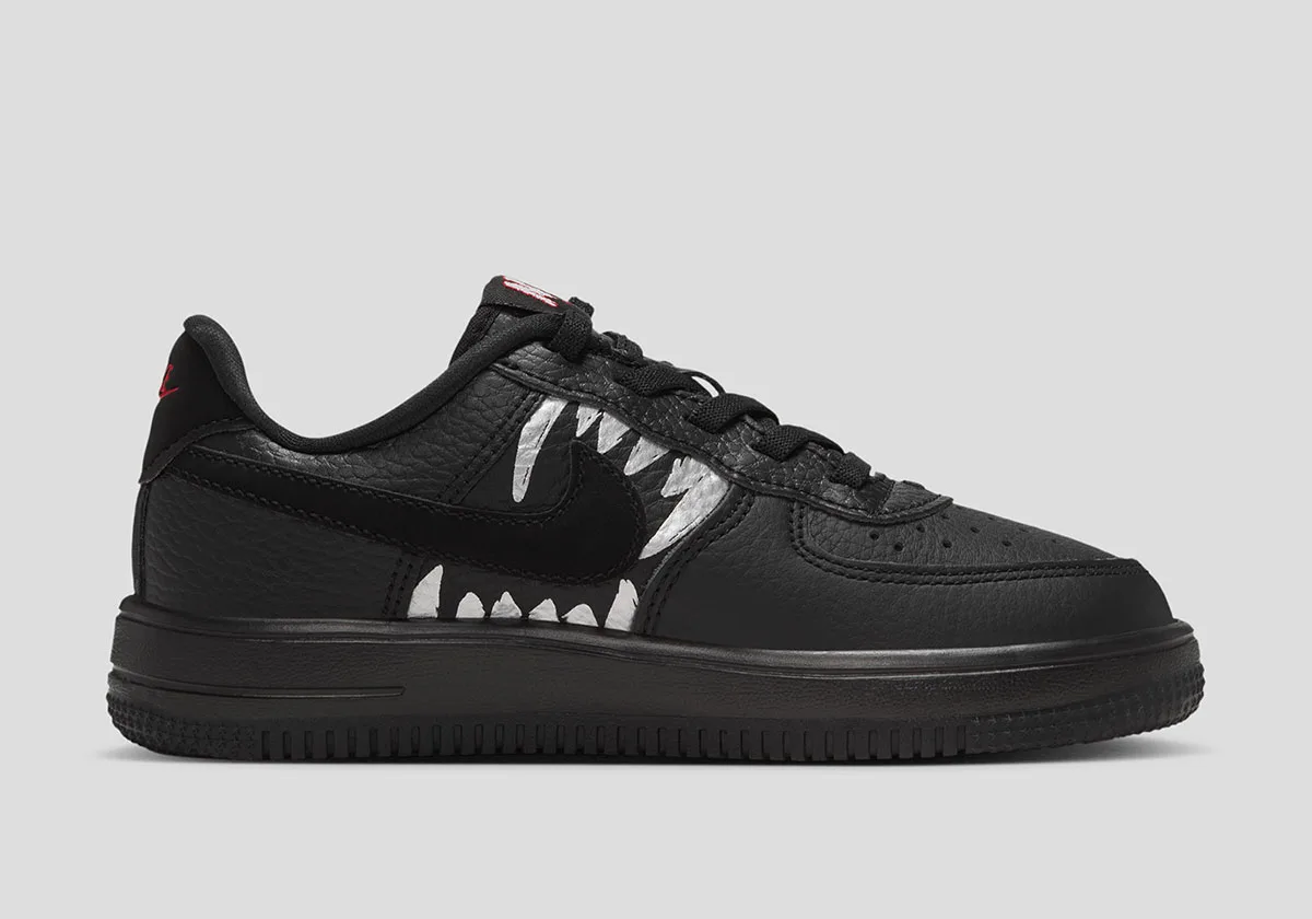 lateral view, black leather with white shark-teeth graphic over the swoosh, Beast