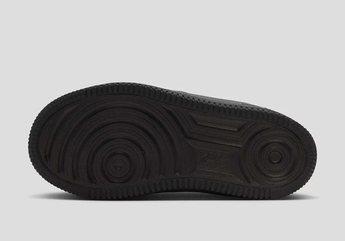 outsole view, black rubber sole with circular tread pattern and Nike text, Beast