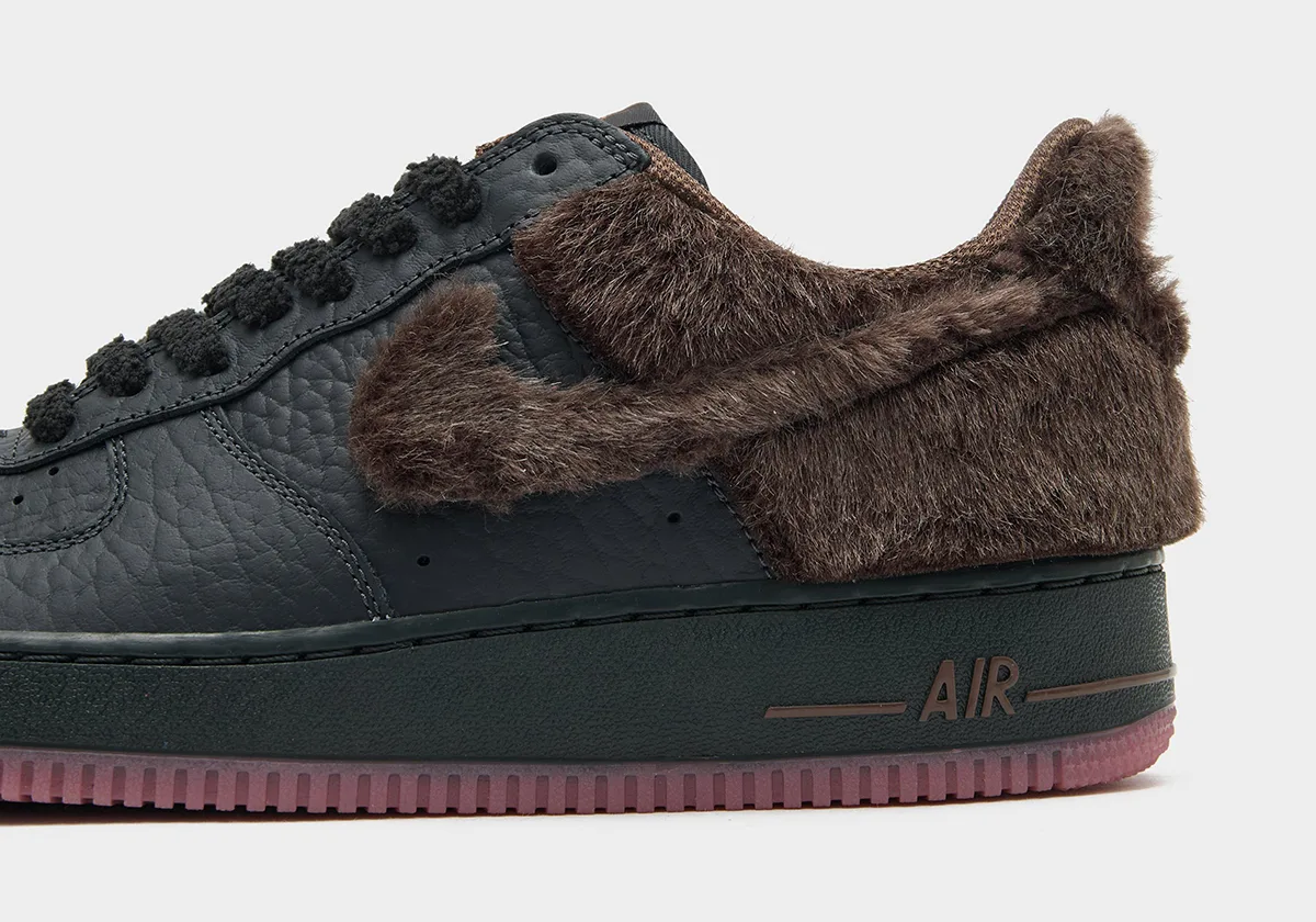 close-up of fur-wrapped heel and swoosh with chenille laces and pink outsole edge, Black Rat