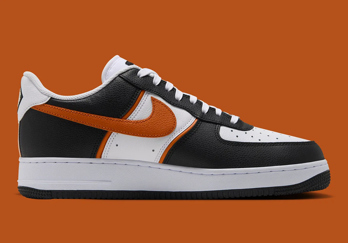 lateral view, black and white upper with bold orange swoosh and white midsole, Campfire Orange