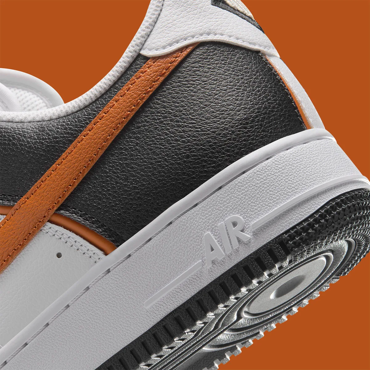 macro detail of heel and midsole, orange piping stitch and embossed Air text on sole, Campfire Orange