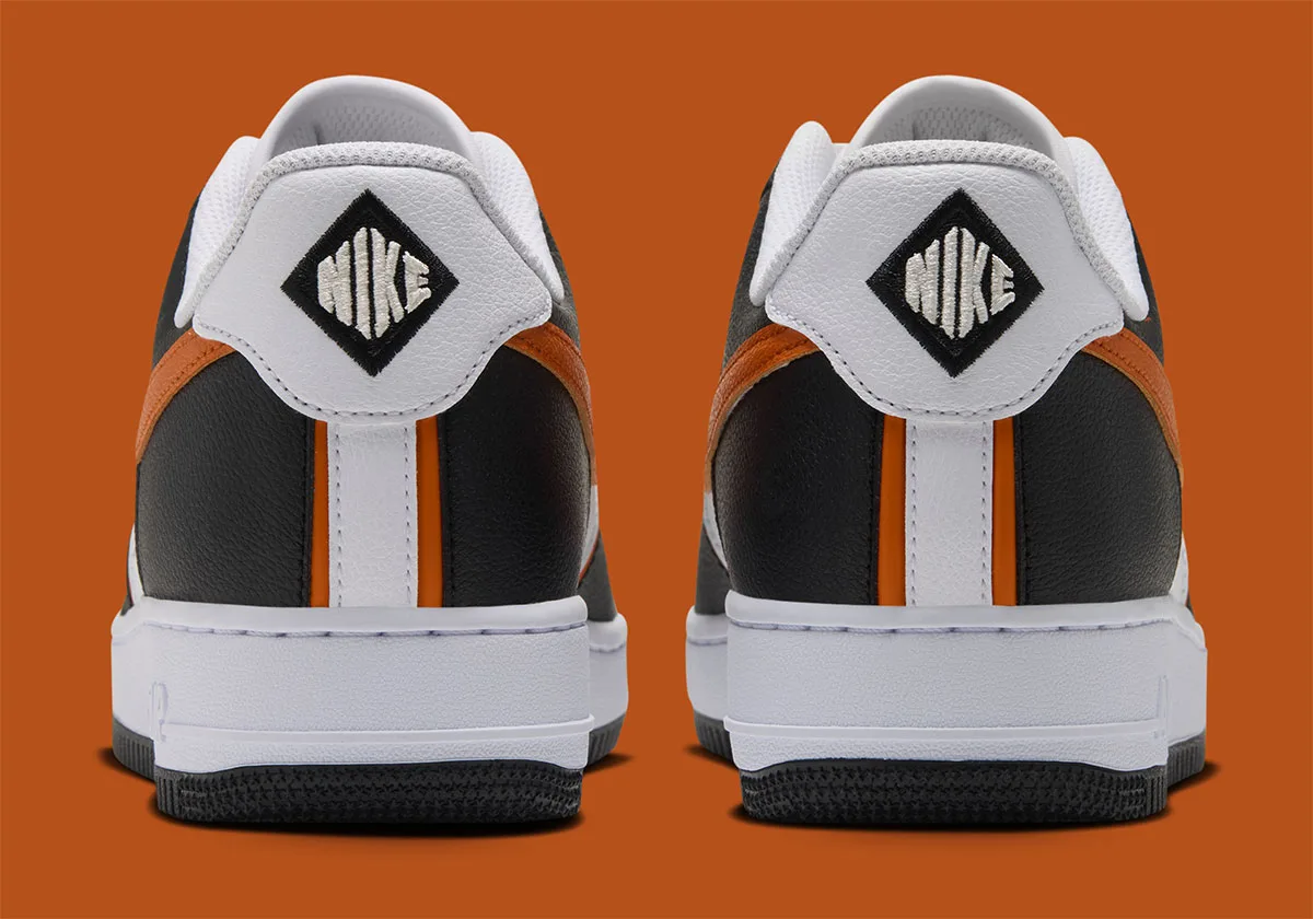 heel view of pair, black counters with orange stripe and white Nike diamond tab, Nike Air Force 1 Low "Campfire Orange"