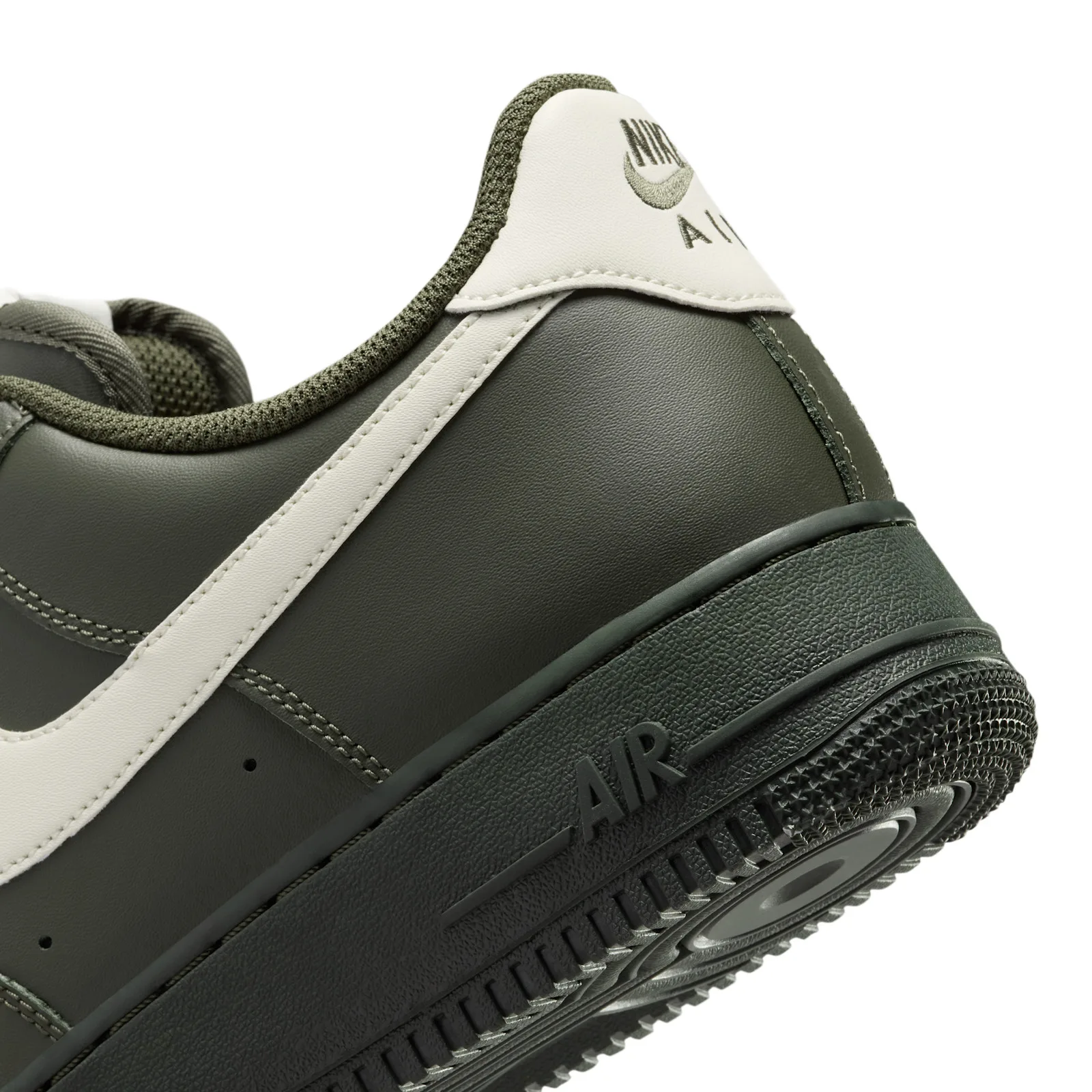 Close-up heel detail, cream Nike Air patch on olive leather panel, Cargo Khaki