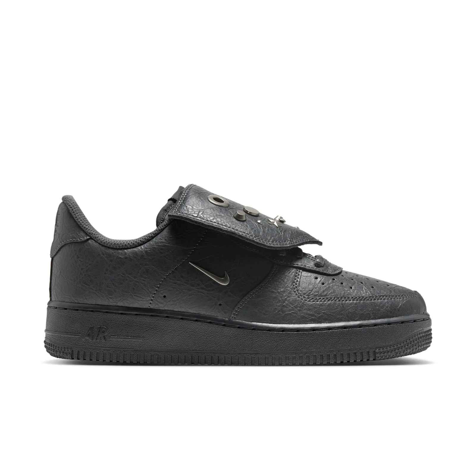 lateral view on white background, charcoal leather upper with grommet, studs and star on tongue flap, Charms