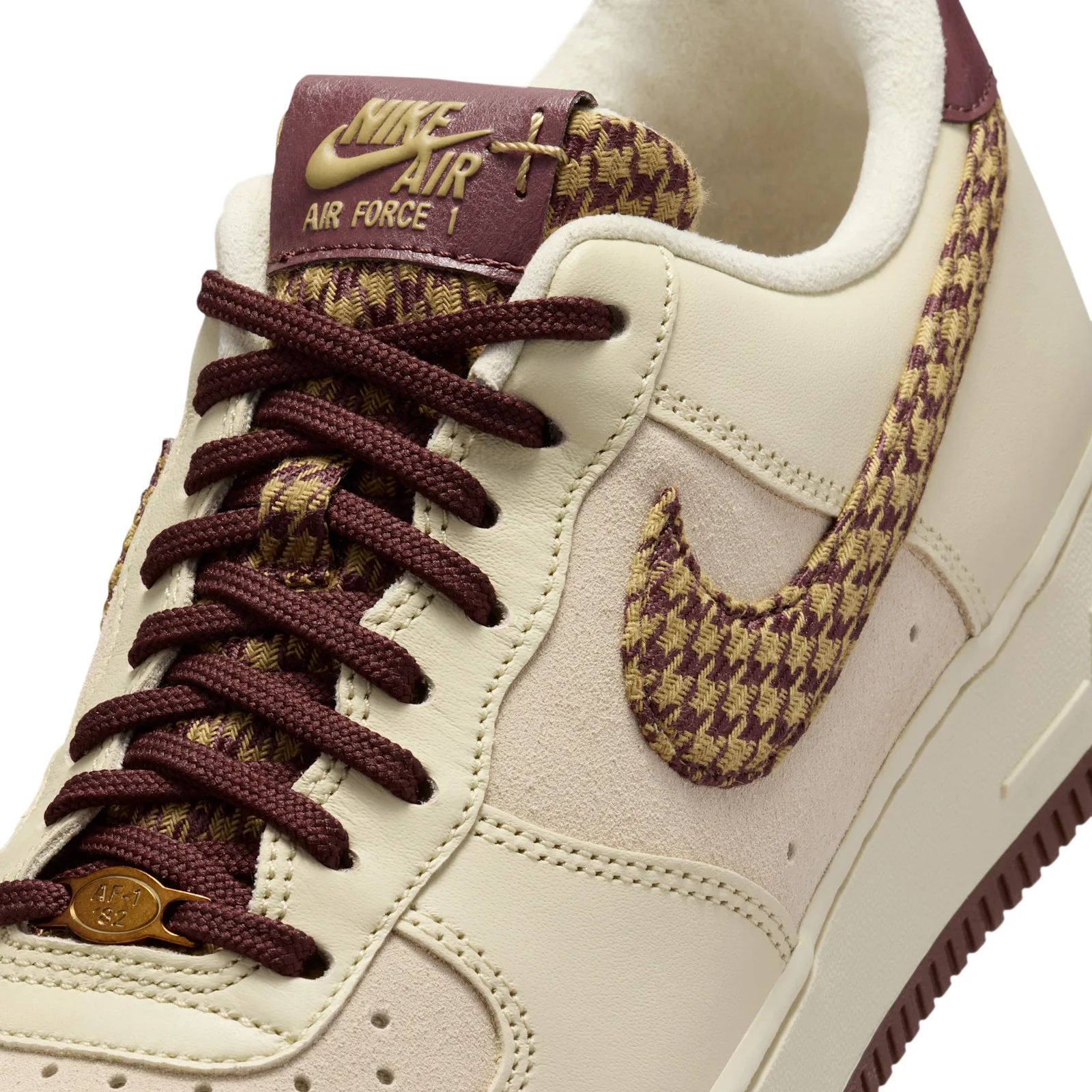 close-up toe and tongue detail, houndstooth swoosh and burgundy Air Force 1 tab, Houndstooth