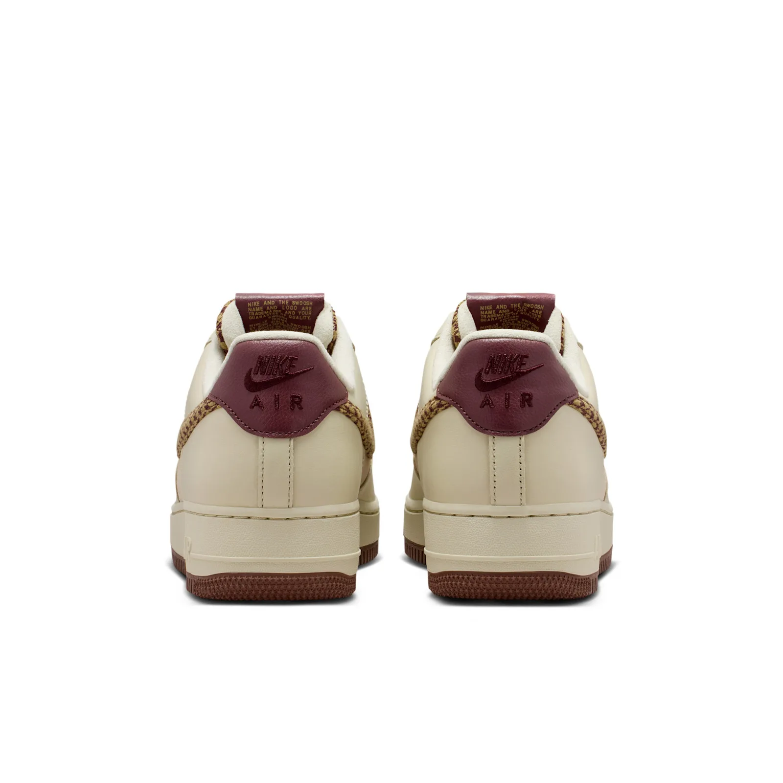 heel view of pair, burgundy Nike Air heel patches on cream uppers, Houndstooth