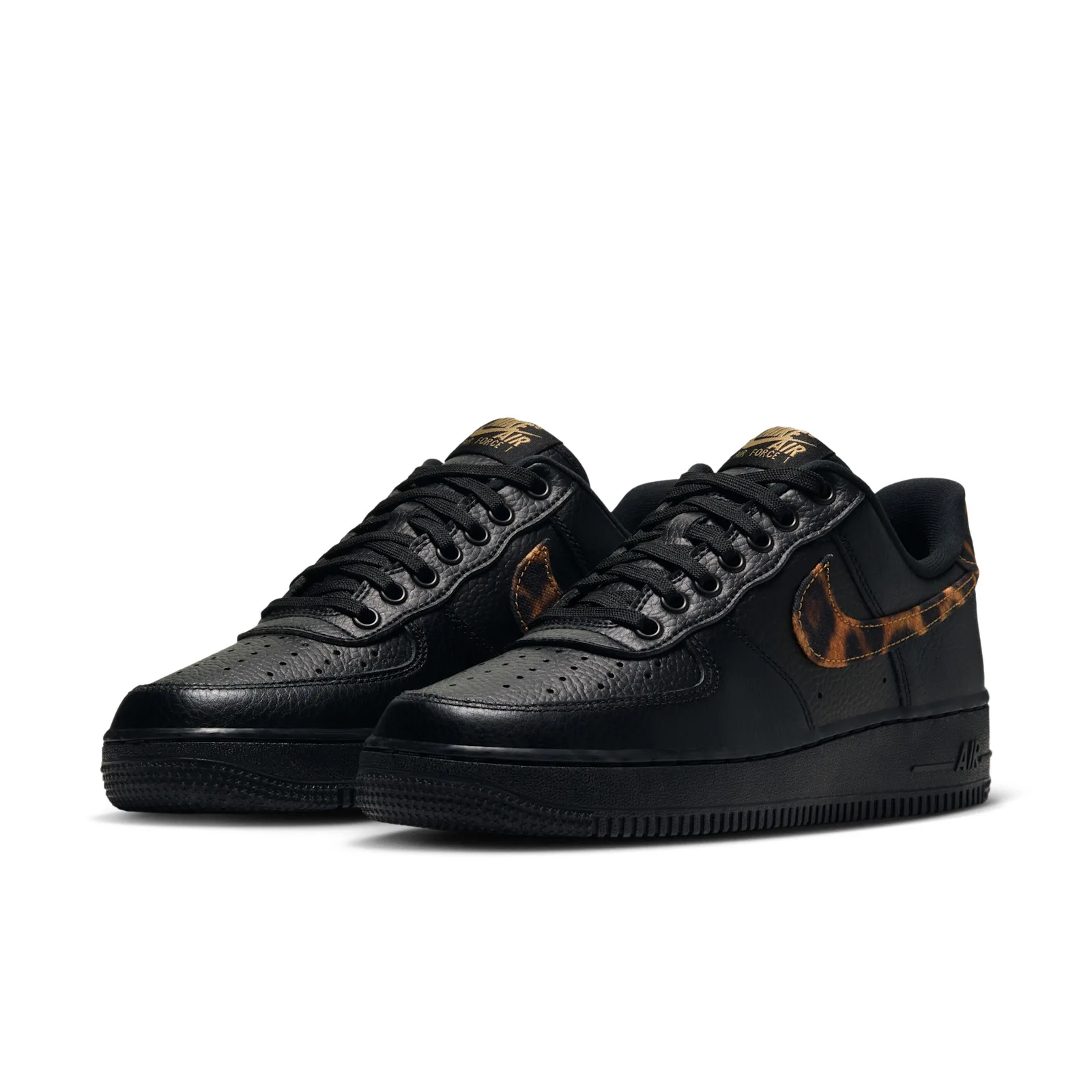 three-quarter view of pair, black leather with leopard-print swoosh and gold tongue text, Leopard
