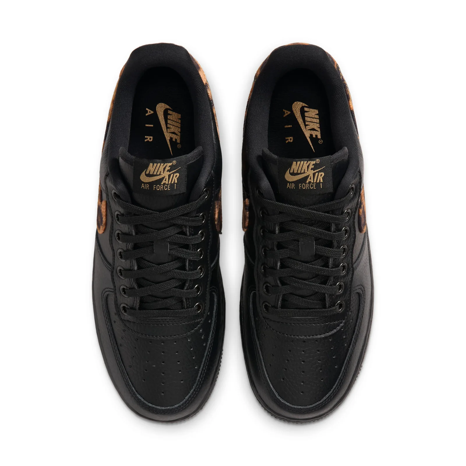 top-down view of pair, black leather with leopard-print tongue lining and gold Nike Air text, Leopard