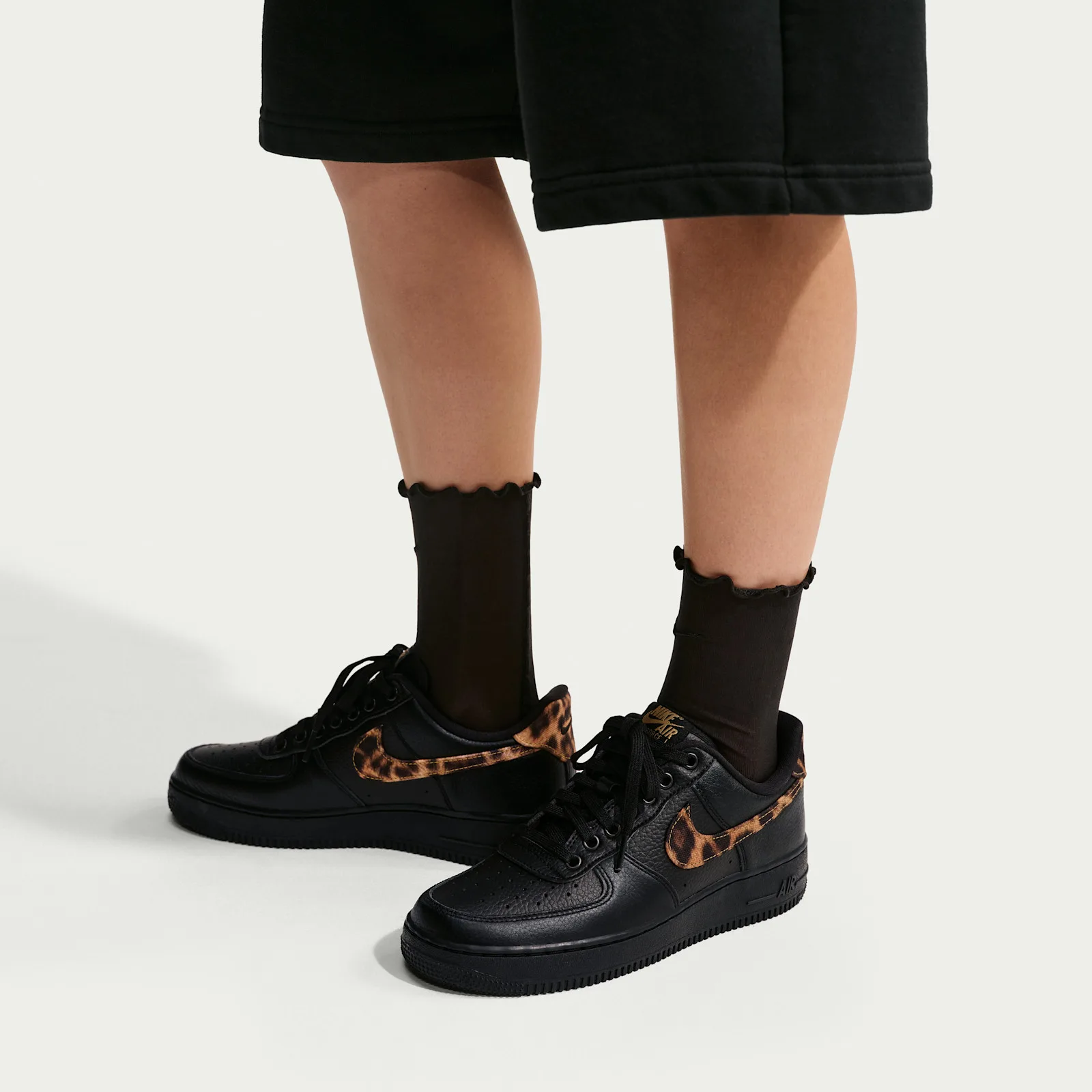 on-foot pair with black ankle socks and black wide-leg trousers, Leopard