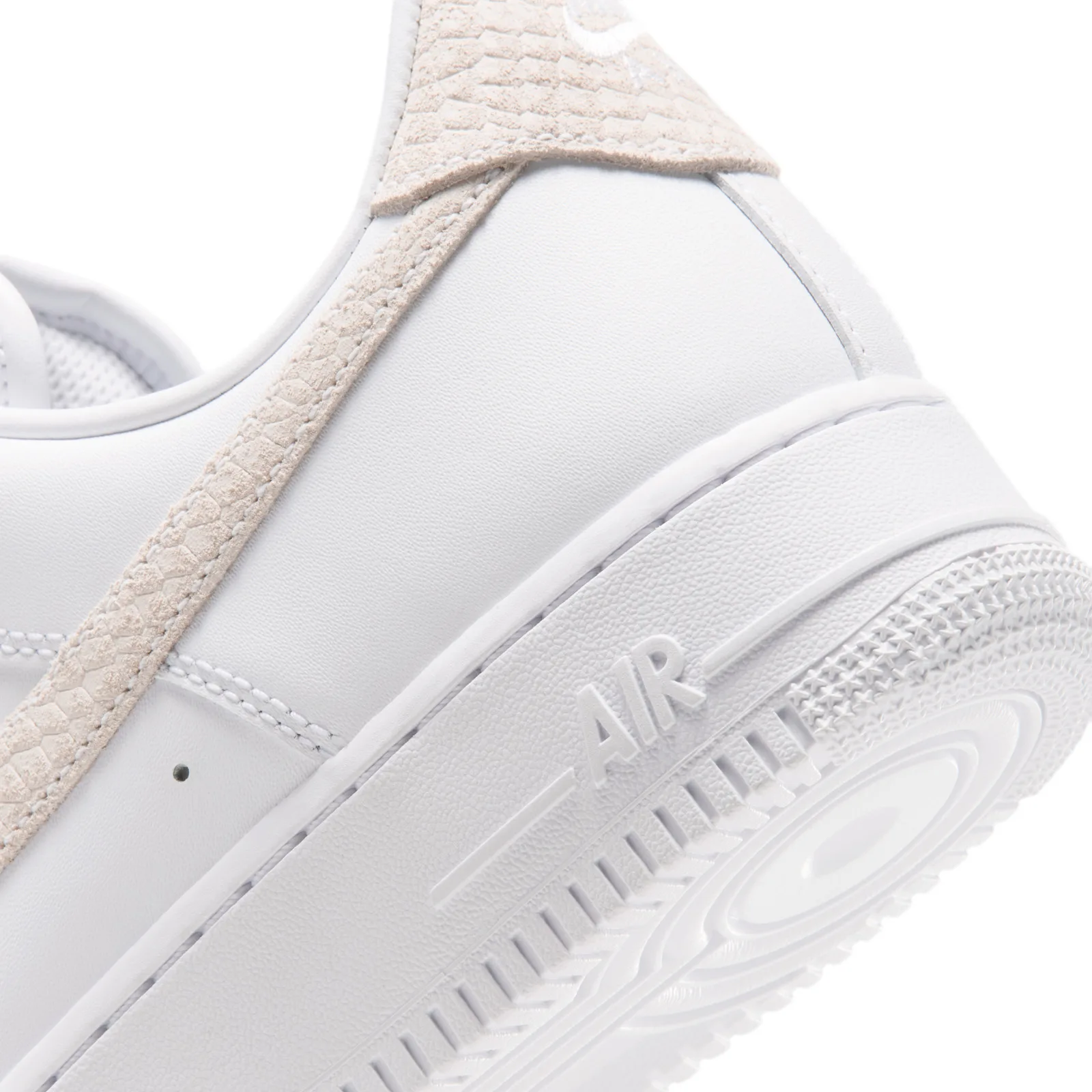 close-up of heel panel, cream snakeskin strip and embossed Air text on sole, Metallic Gold Charms