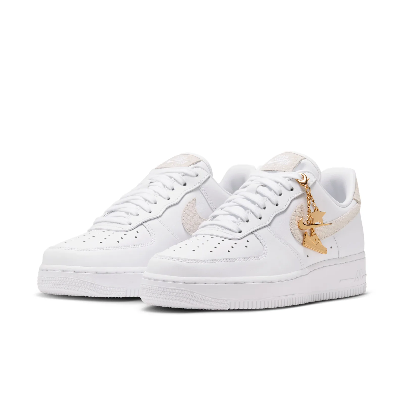 angled pair view, cream snakeskin swooshes, gold star and mini sneaker charms on left shoe, Metallic Gold Charms