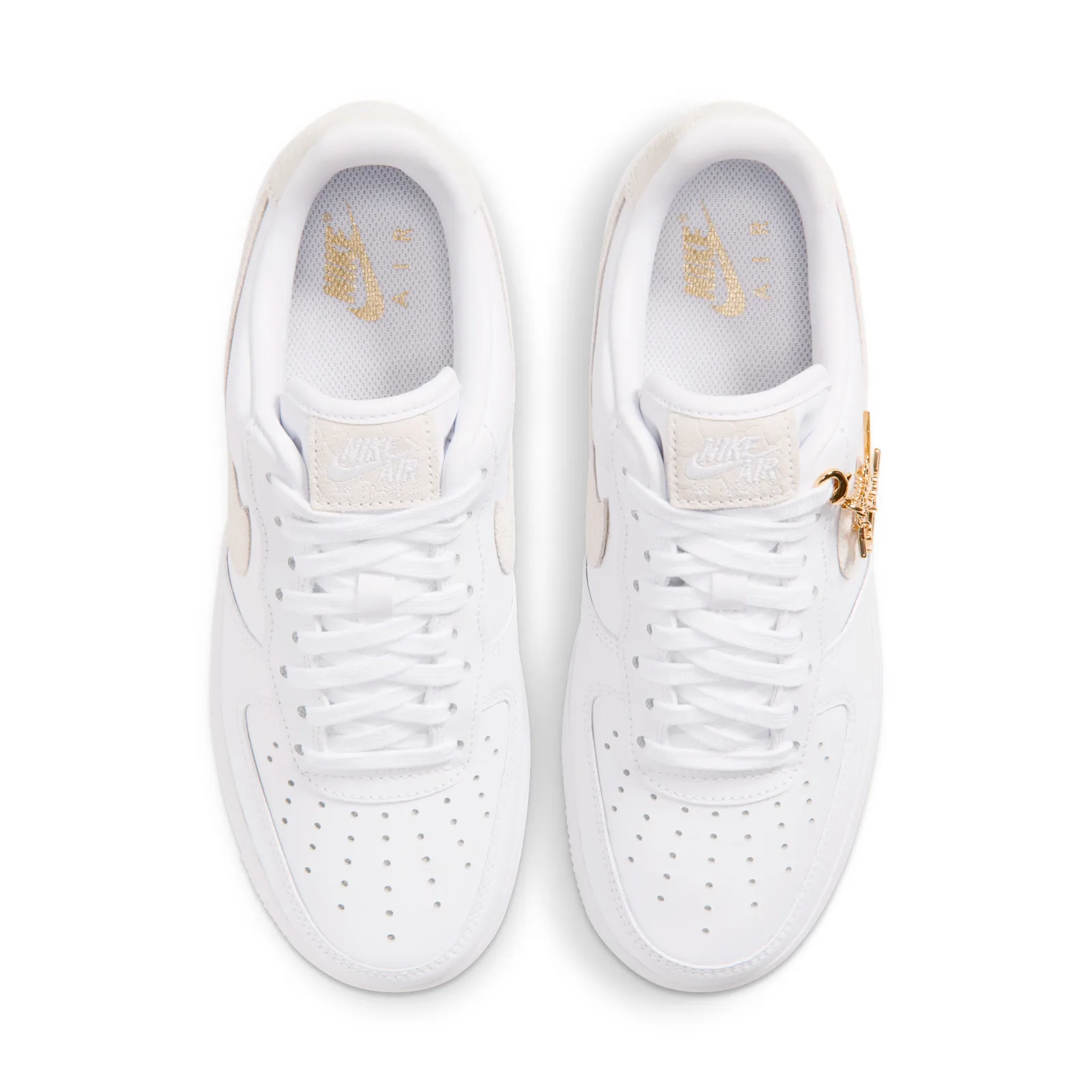 top-down pair view, gold Nike Air print on insoles, cream snakeskin swoosh and charms, Metallic Gold Charms