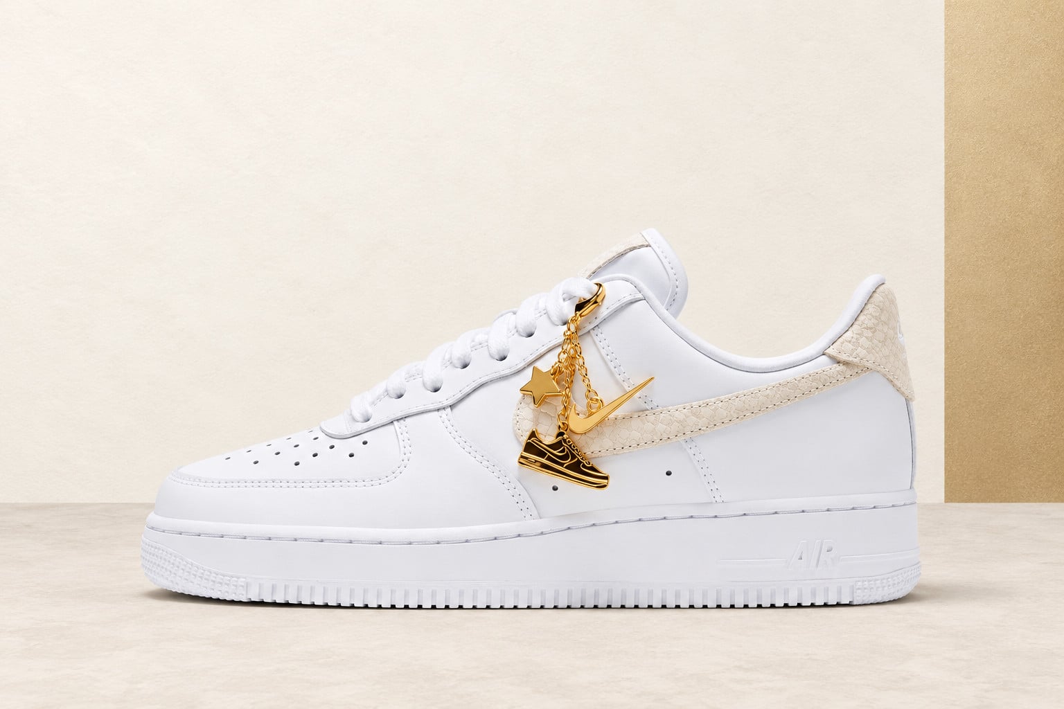 lateral view, white leather with cream snakeskin swoosh, gold star and sneaker, Nike Air Force 1 Low “Metallic Gold Charms”