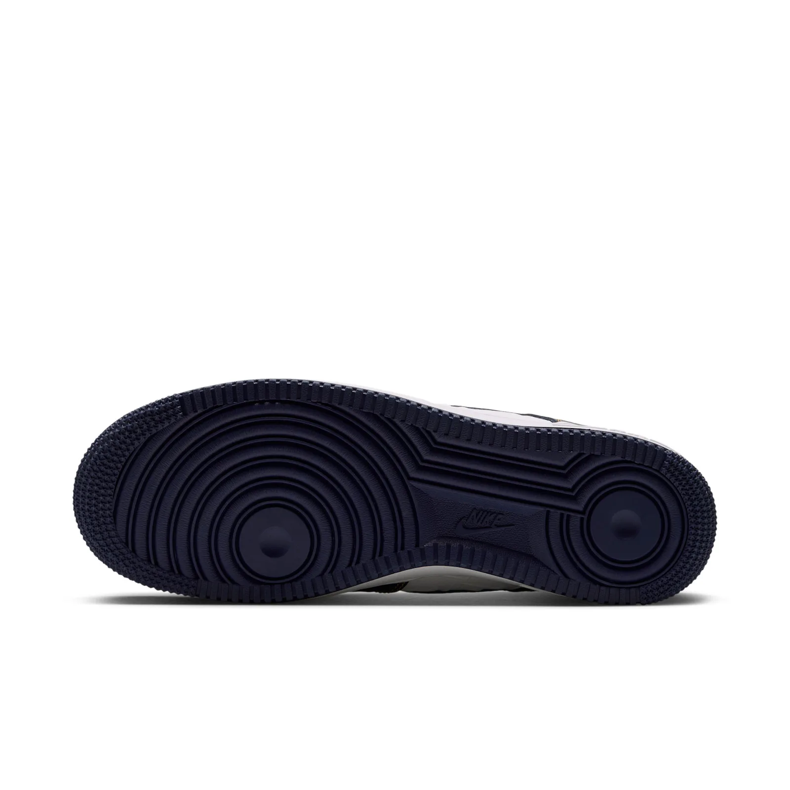 outsole view showing navy waffle tread and embossed Nike text, Low Mini Swoosh