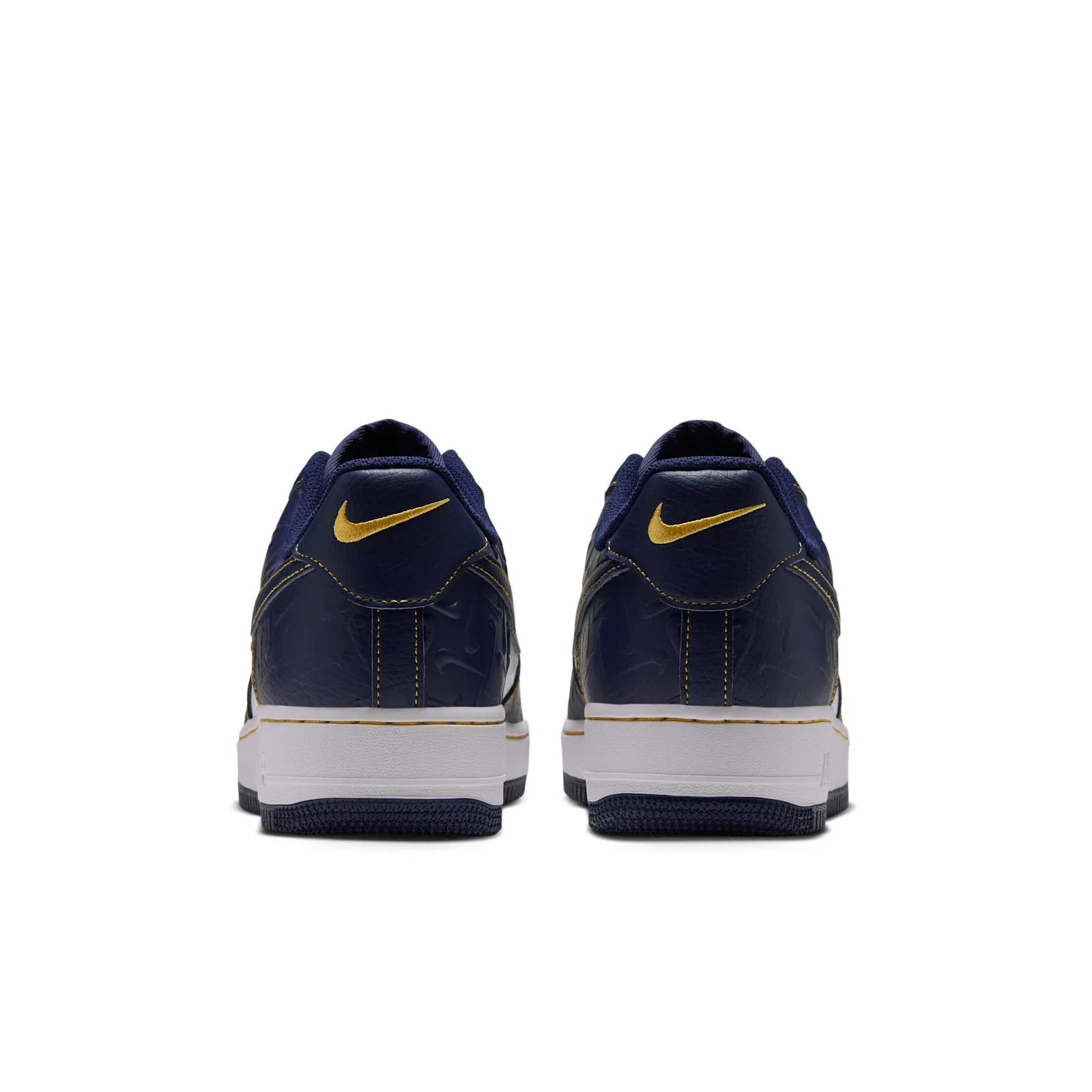 heel view of the pair, gold Nike swoosh embroidery on navy, Low Mini Swoosh