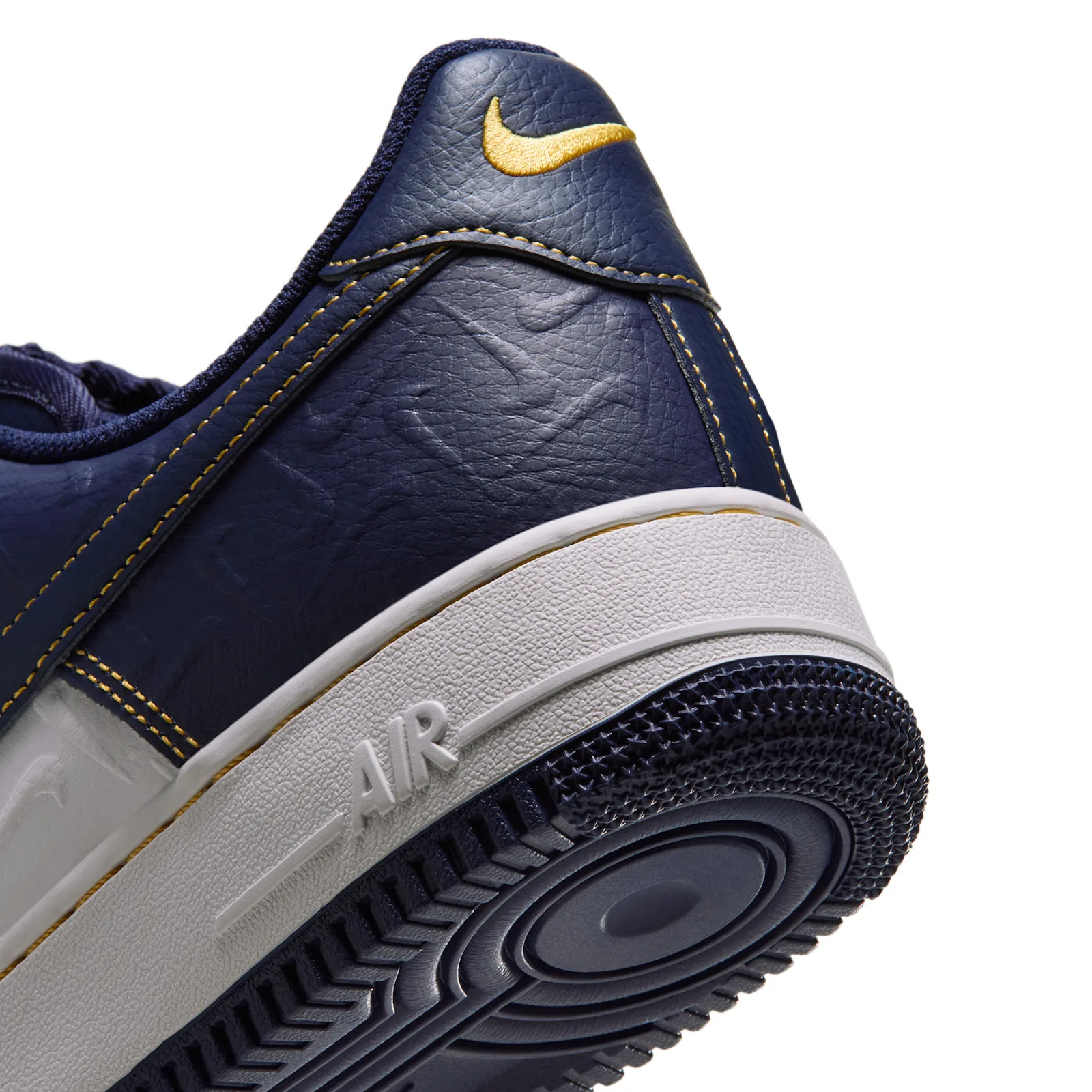close-up heel detail, gold swoosh embroidery and white AIR midsole, Low Mini Swoosh
